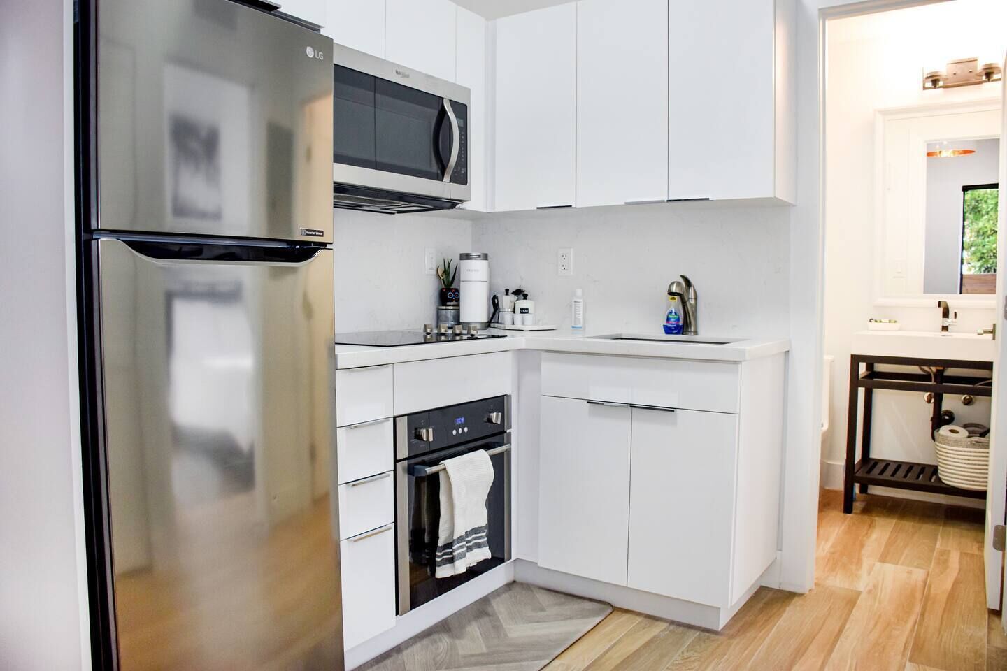 Fridge, microwave, stovetop, coffee/tea maker