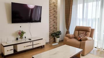 55-inch Smart TV with cable channels, Netflix, first-run movies