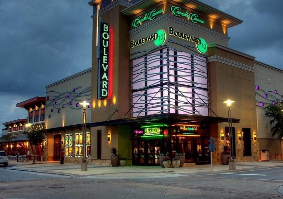 A building with a sign reading 'Boulevard 10' and 'Carmel Cinemas.'