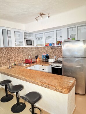 Private kitchen - 4-bedroom family condo with 8 pools and a private beach (Puerto Vallarta)