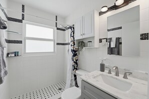 Shower, hair dryer, towels, soap