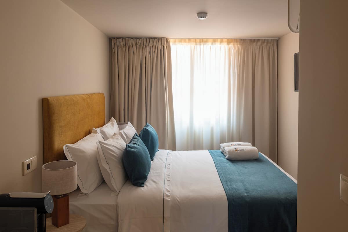 Quarto casal conforto, vista para a cidade | Wi-Fi de cortesia