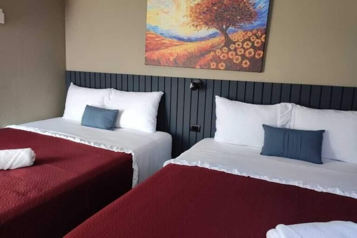 Family Room, Multiple Beds, Smoking, Housekeeping | Down comforters, Select Comfort beds, desk, free WiFi