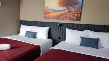 Family Room, Multiple Beds, Smoking, Housekeeping | Down comforters, Select Comfort beds, desk, free WiFi
