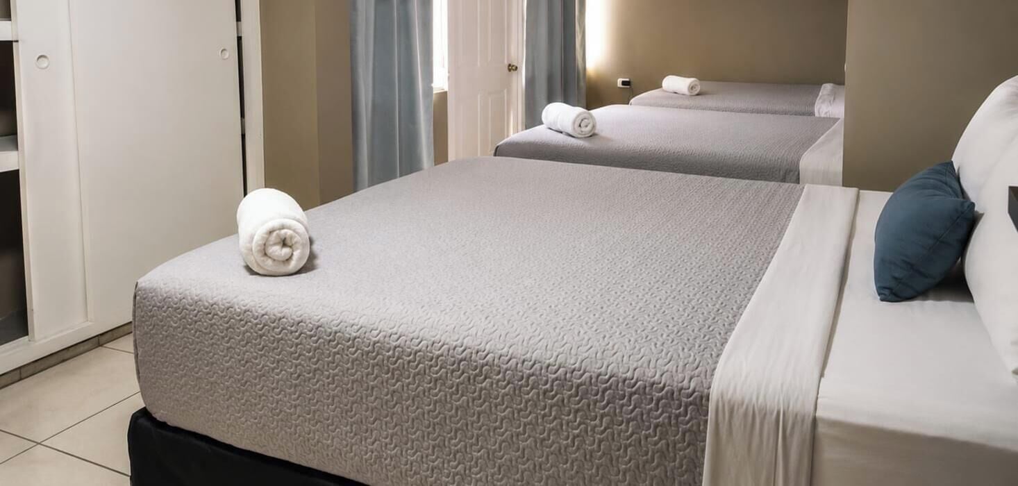 Family Room, Multiple Beds, Smoking, Housekeeping | Down duvets, Select Comfort beds, desk, free WiFi