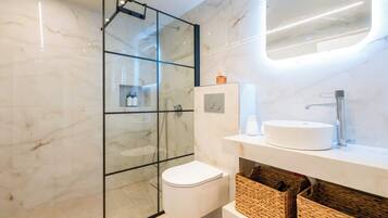 Shower, hair dryer, towels, shampoo