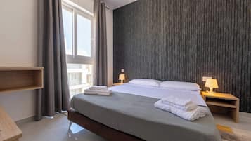 3 habitaciones, tabla de planchar con plancha, wifi y ropa de cama