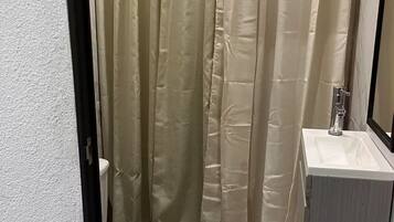 Shower, hair dryer, towels, toilet paper