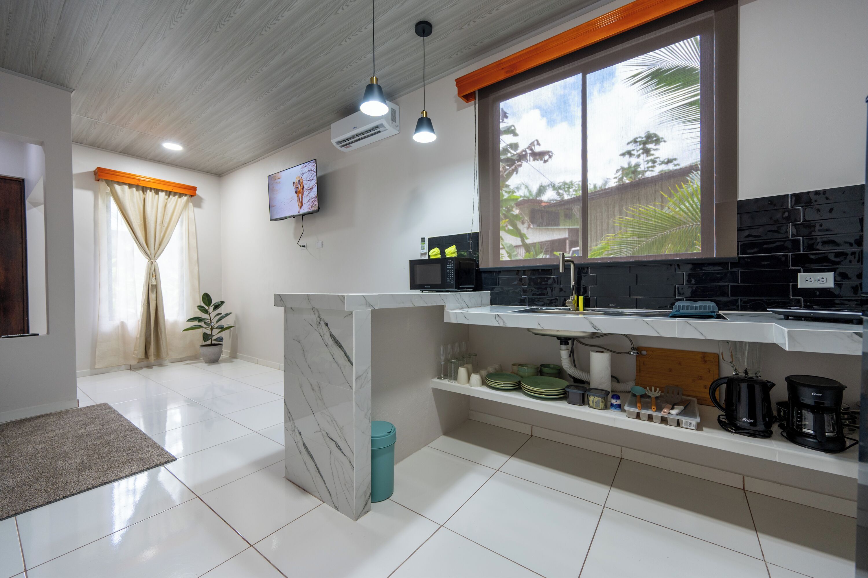 Fridge, microwave, stovetop, coffee/tea maker