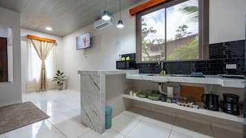 Fridge, microwave, stovetop, coffee/tea maker