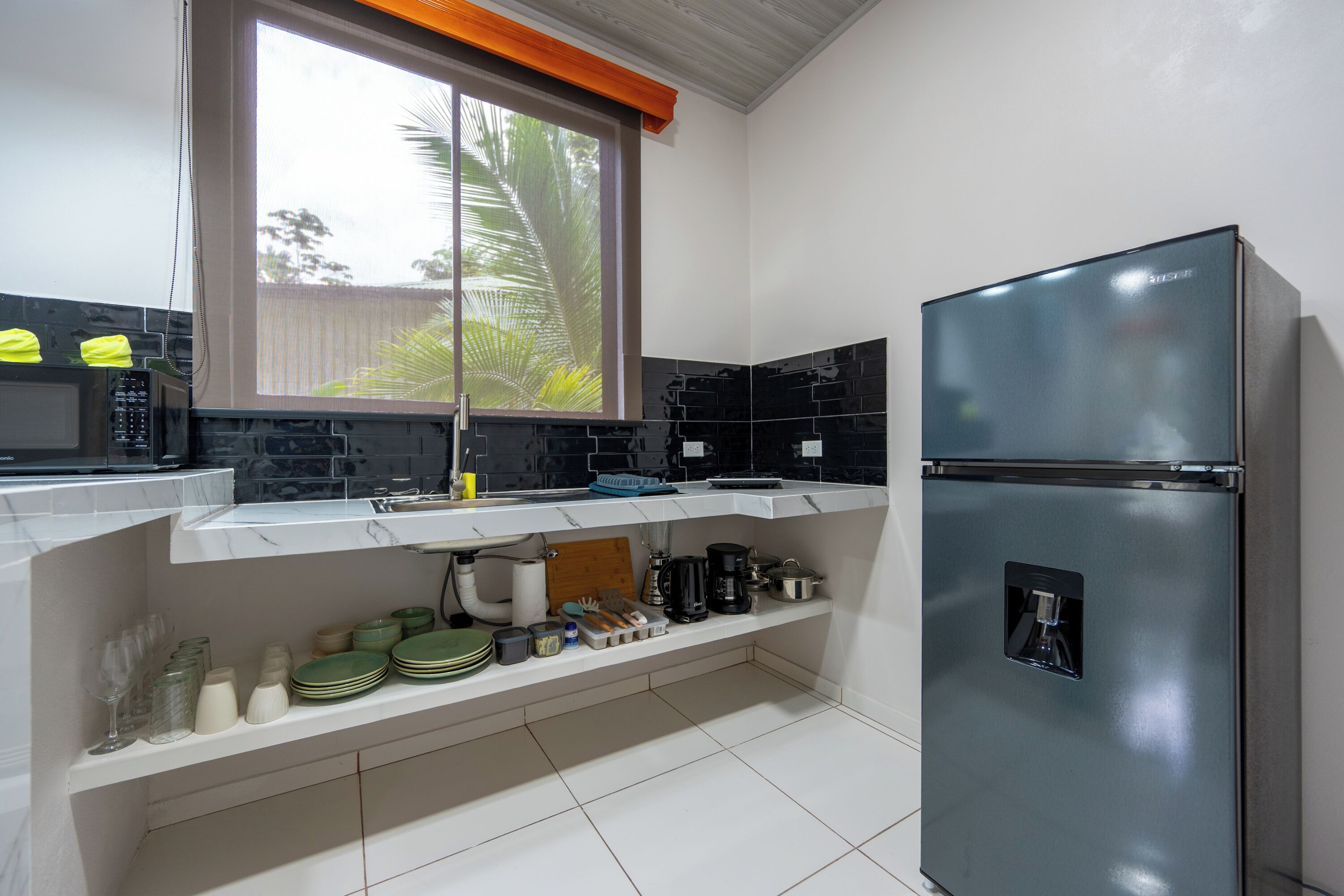 Fridge, microwave, stovetop, coffee/tea maker
