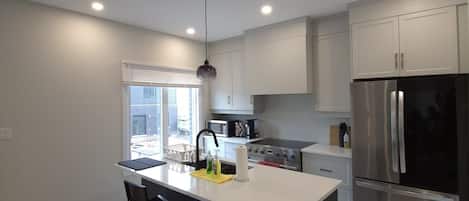 Coffee/tea maker, fridge, microwave, oven