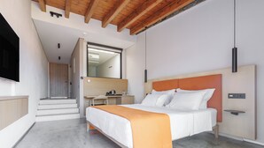 A modern bedroom with a bed, a desk, and a mirror. - KHAI SYVOTA (Igoumenitsa)