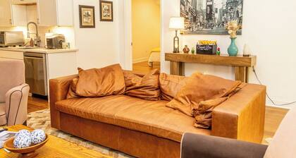 The New Amsterdam Nook: European-inspired guest suite in Mechanicsville. Features 2 bedrooms, 1 spa-like bath, full kitchen, indoor fireplace, dedicated workspace. Enjoy a large yard with pool, hot tub, playground, and BBQ. Comfortably fits 4-6.