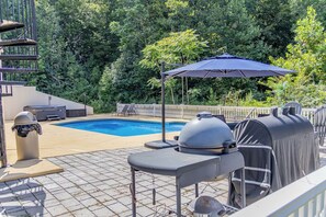 A backyard with a swimming pool, barbecue grill, and outdoor seating. - The New Amsterdam Nook: European-inspired guest suite in Mechanicsville. Features 2 bedrooms, 1 spa-like bath, full kitchen, indoor fireplace, dedicated workspace. Enjoy a large yard with pool, hot tub, playground, and BBQ. Comfortably fits 4-6. (Mechanicsville)
