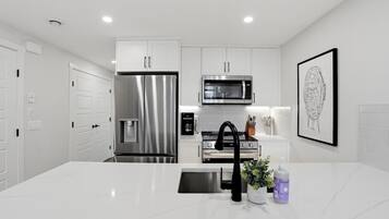 Coffee/tea maker, fridge, microwave, oven