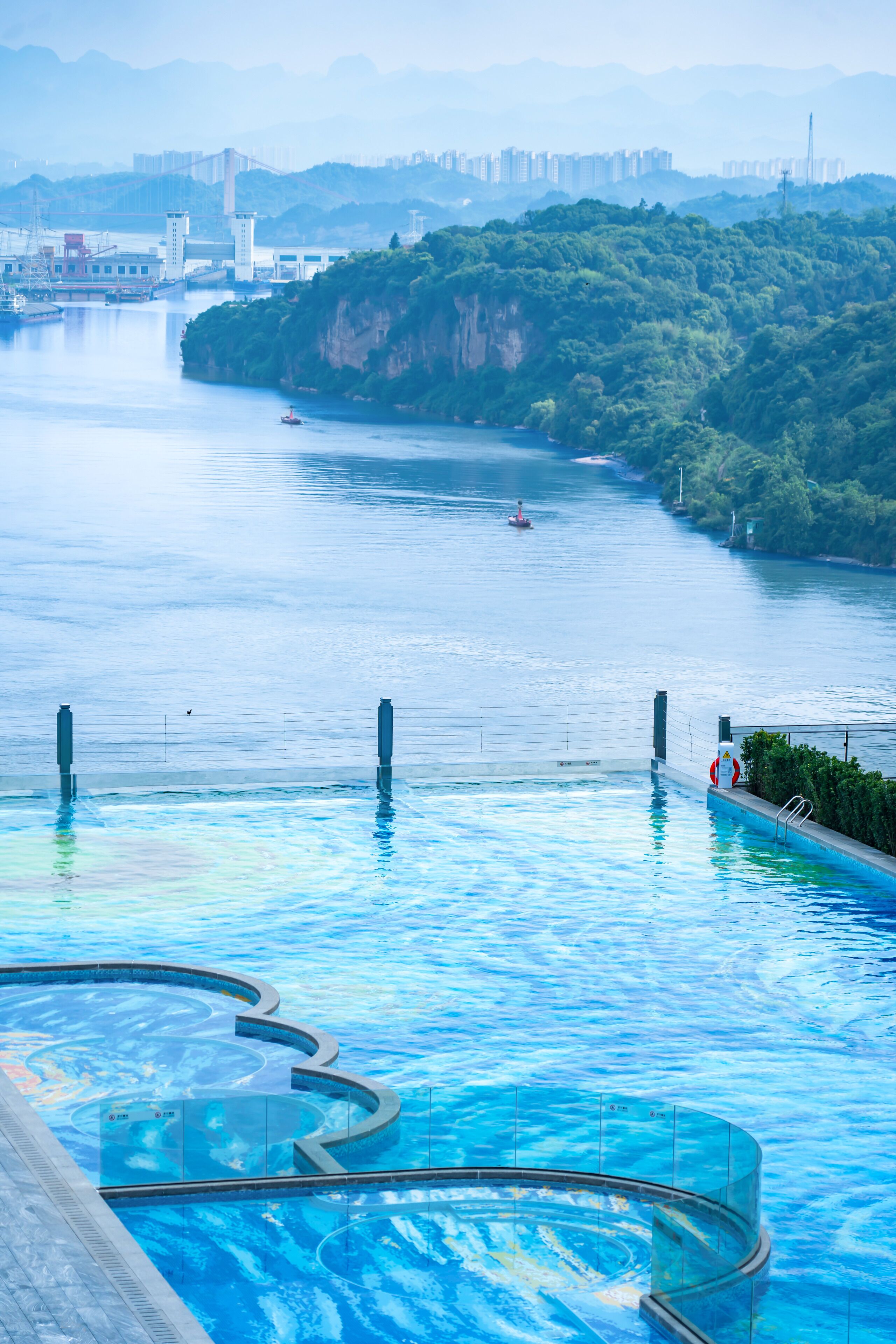 Outdoor pool, open 9:00 AM to 9:00 PM, pool umbrellas