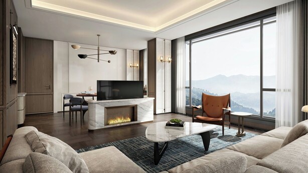 Una sala de estar moderna con chimenea, televisor y un amplio ventanal con vistas a la montaña.