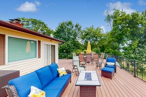 A deck with outdoor furniture, including a sofa, chairs, and a table. - Charming Getaway With a Fireplace, Large Deck, Paddle Boards & Porch Swing (Mineral)