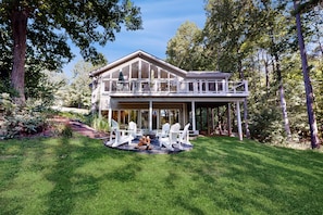 A two-story house with a balcony, surrounded by a well-maintained lawn and trees. - Spacious pet Friendly House W/private Pool Table, Ping Pong Table & Free Wifi (Bumpass)
