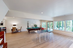 A spacious room with a pool table, a ping pong table, and a billiards table. - Spacious pet Friendly House W/private Pool Table, Ping Pong Table & Free Wifi (Bumpass)