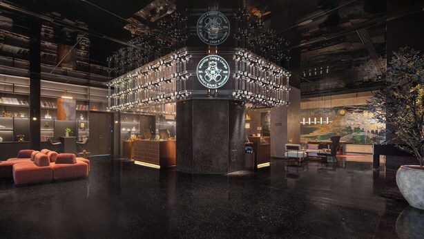 A modern lobby with a central circular structure, seating areas, and a bar. - Wanda Moments Zhuhai (Zhuhai)