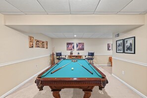 A pool table in a room with beige walls and a ceiling with recessed lighting. - Lakefront Retreat With Views, hot Tub, Kid's Play Area, Dock & Fiber Internet (Mineral)
