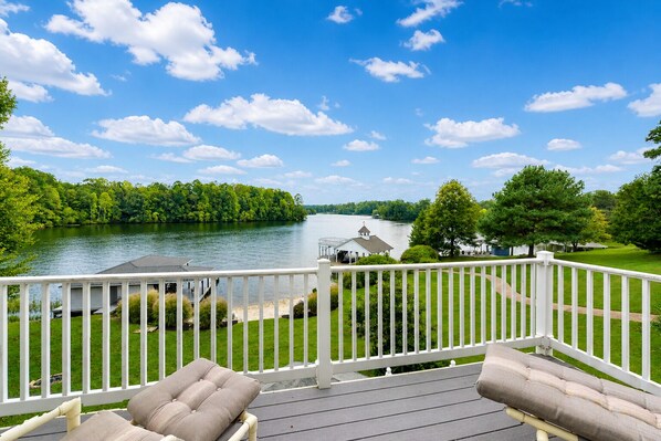 A deck with a view of a lake, a gazebo, and a grassy area. - Lakefront Retreat With Views, hot Tub, Kid's Play Area, Dock & Fiber Internet (Mineral)