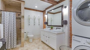 Shower, hair dryer, towels, toilet paper