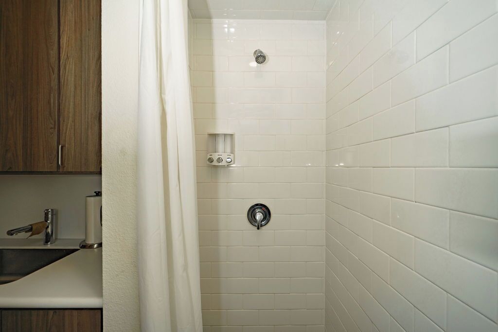 Shower, towels, soap, toilet paper