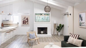 Ein modernes Wohnzimmer mit Kamin, weißen Ziegelwänden und einem Essbereich mit Barhocker.
