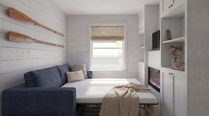 A room with a sofa, a bed, a window with blinds, a fireplace, and wooden paddles on the wall. - Crystal Lake East End Retreat with Dock, Hot Tub & Sunset Views (Beulah)