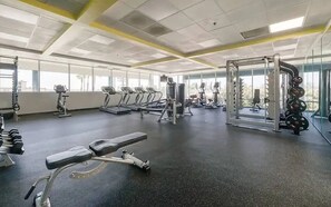 A gym with treadmills, weight machines, and free weights. - Top-Floor Studio. Pool, Hot Tub &FreeParking (Los Angeles)