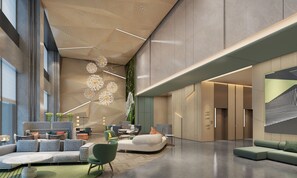 A spacious lobby with modern furniture, a high ceiling with hanging lights, and a large wall with a geometric design. - Holiday Inn Yongkang (Jinhua)