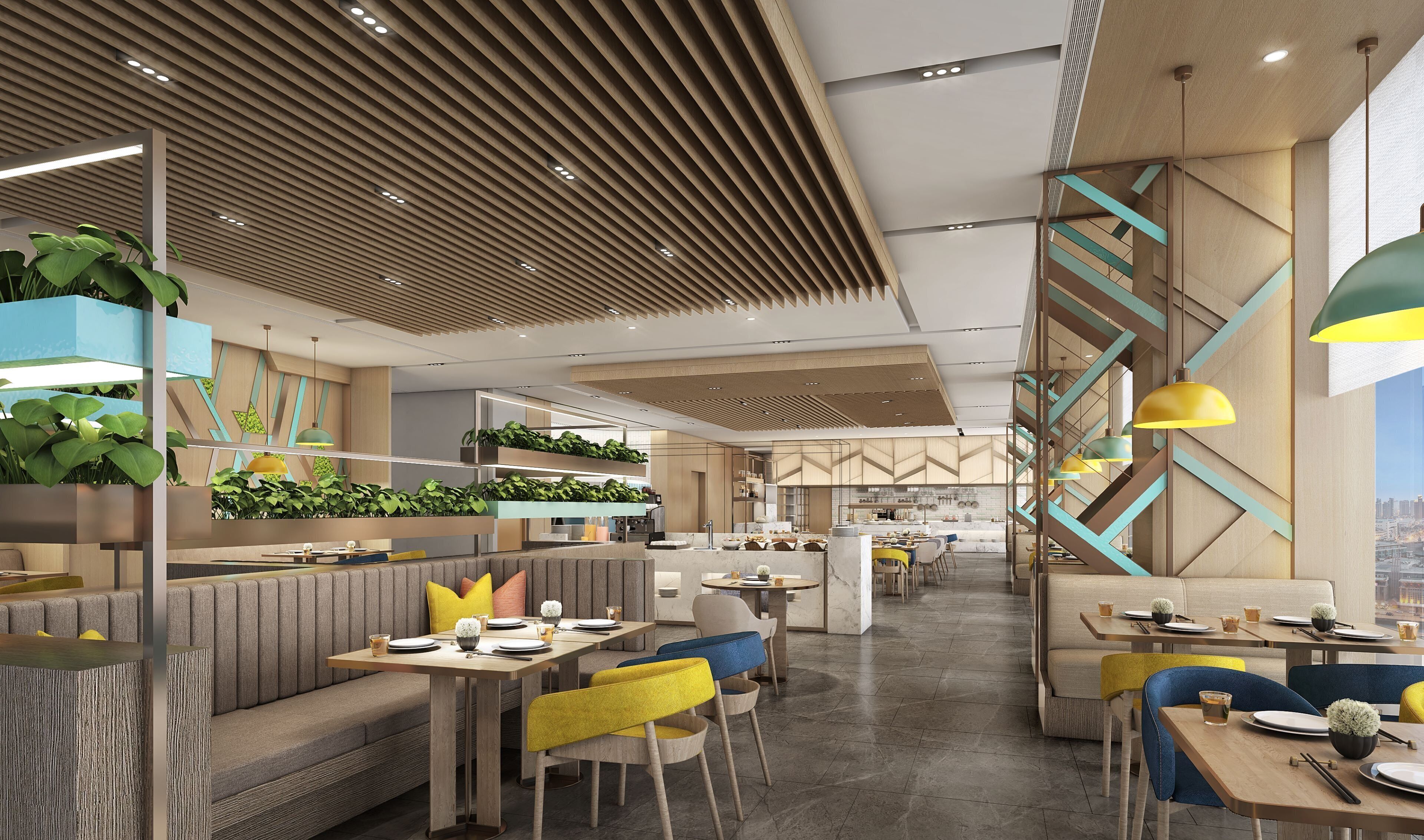 A modern restaurant with high ceilings, wooden slats, and a central staircase.
