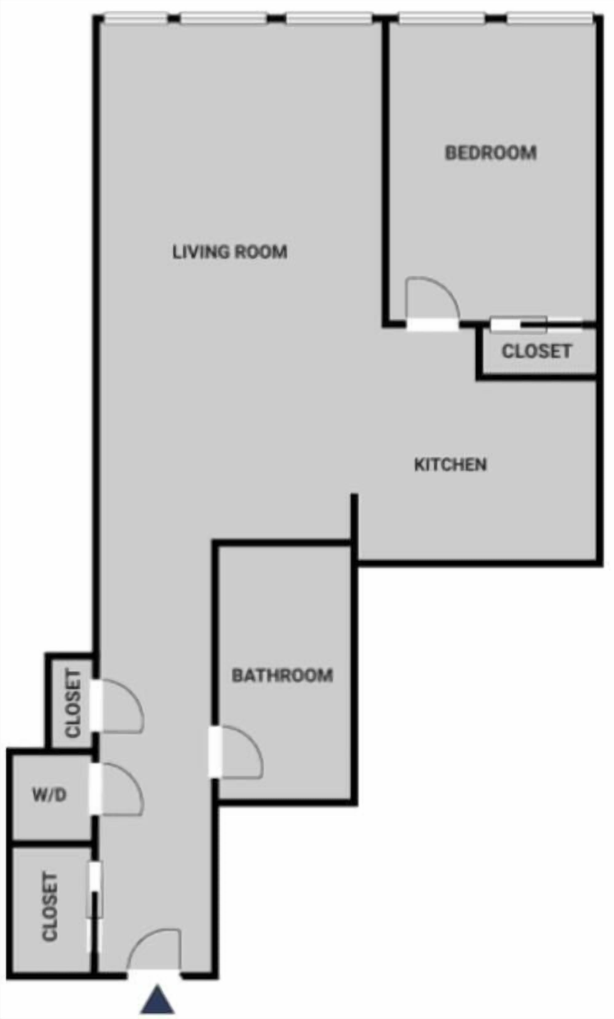 Ein Grundriss mit Wohnzimmer, Schlafzimmer, Küche, Bad und zwei Abstellkammern.