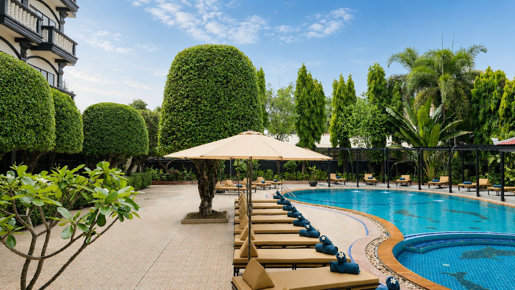 Outdoor pool, open 9:00 AM to 9:00 PM, pool umbrellas, sun loungers