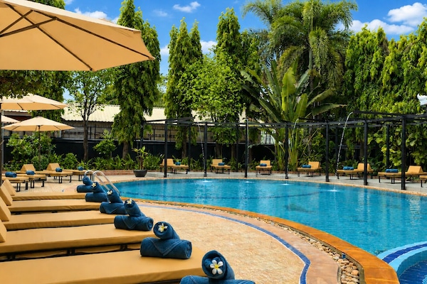 Outdoor pool, open 9:00 AM to 9:00 PM, pool umbrellas, pool loungers
