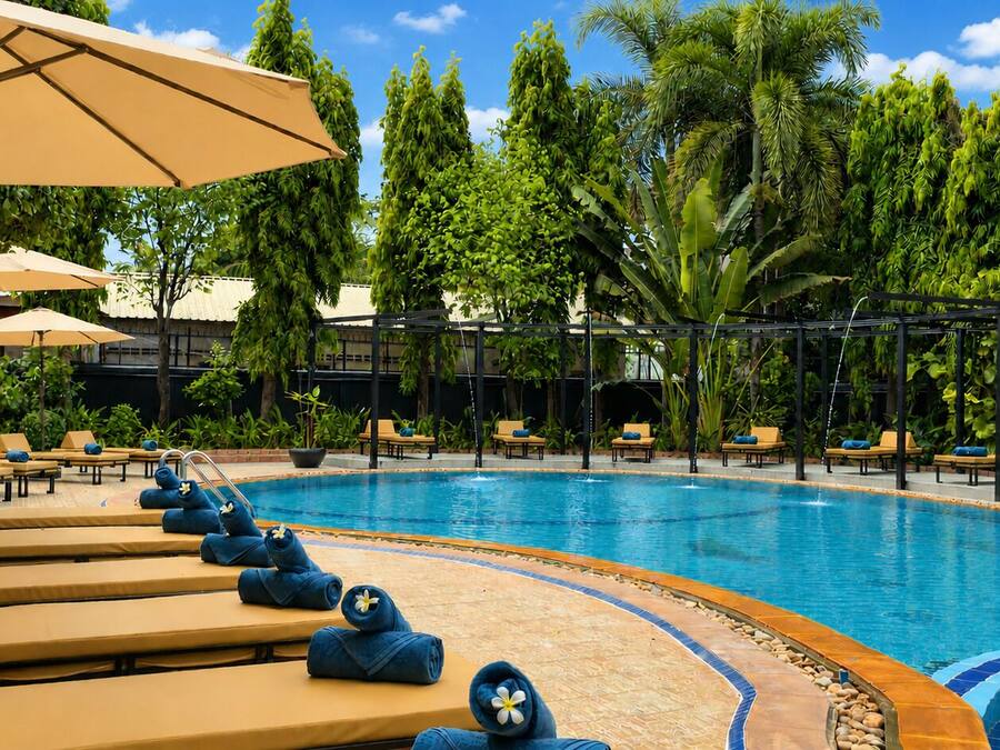 Outdoor pool, open 9:00 AM to 9:00 PM, pool umbrellas, pool loungers