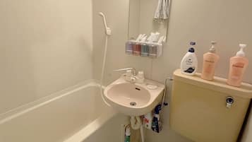 Combined shower/tub, hair dryer, towels, soap