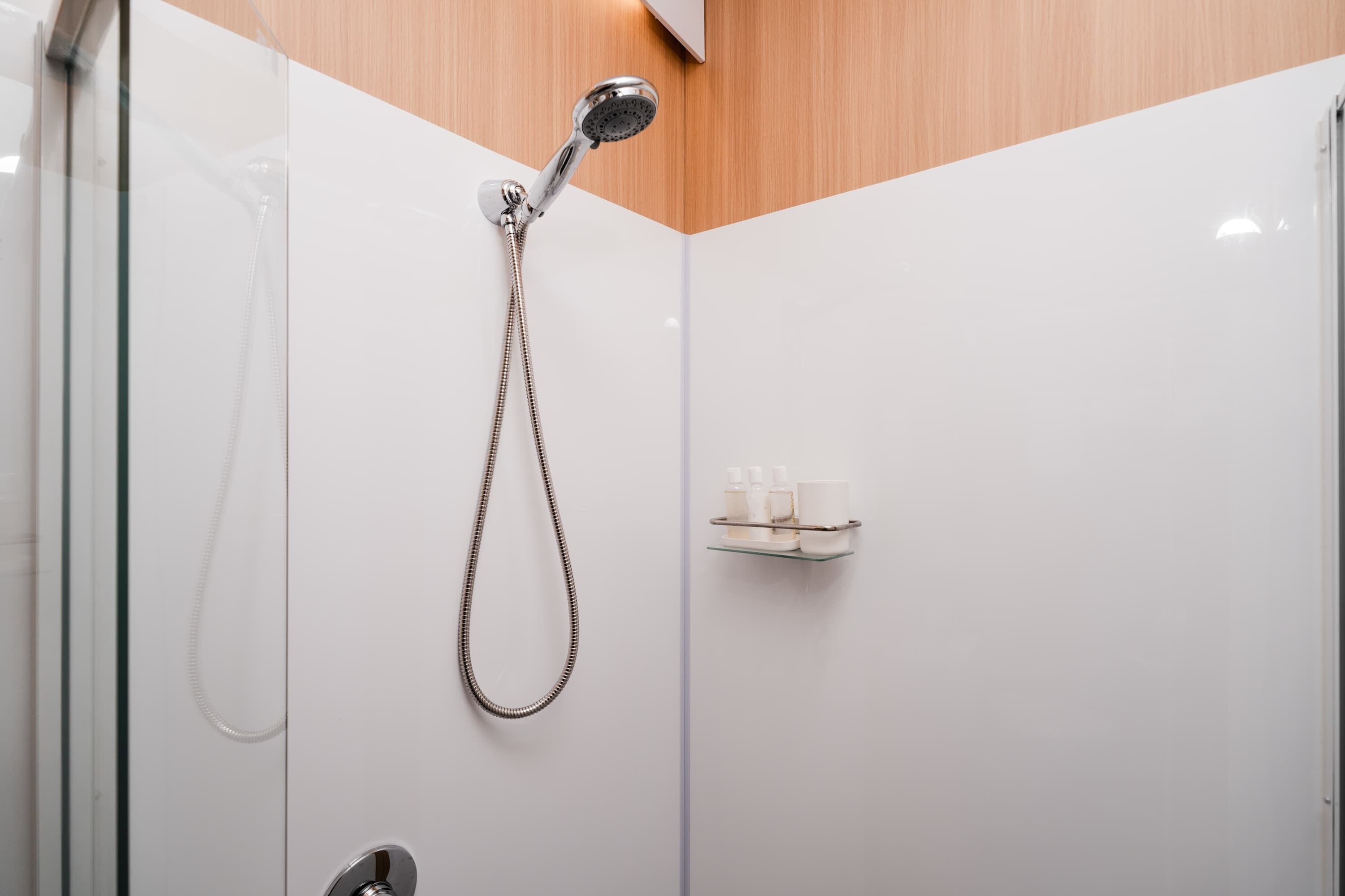 Shower, hair dryer, towels, shampoo