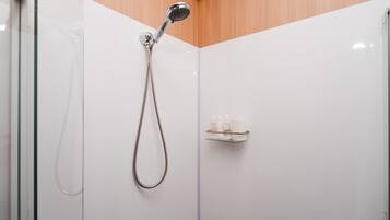 Shower, hair dryer, towels, shampoo