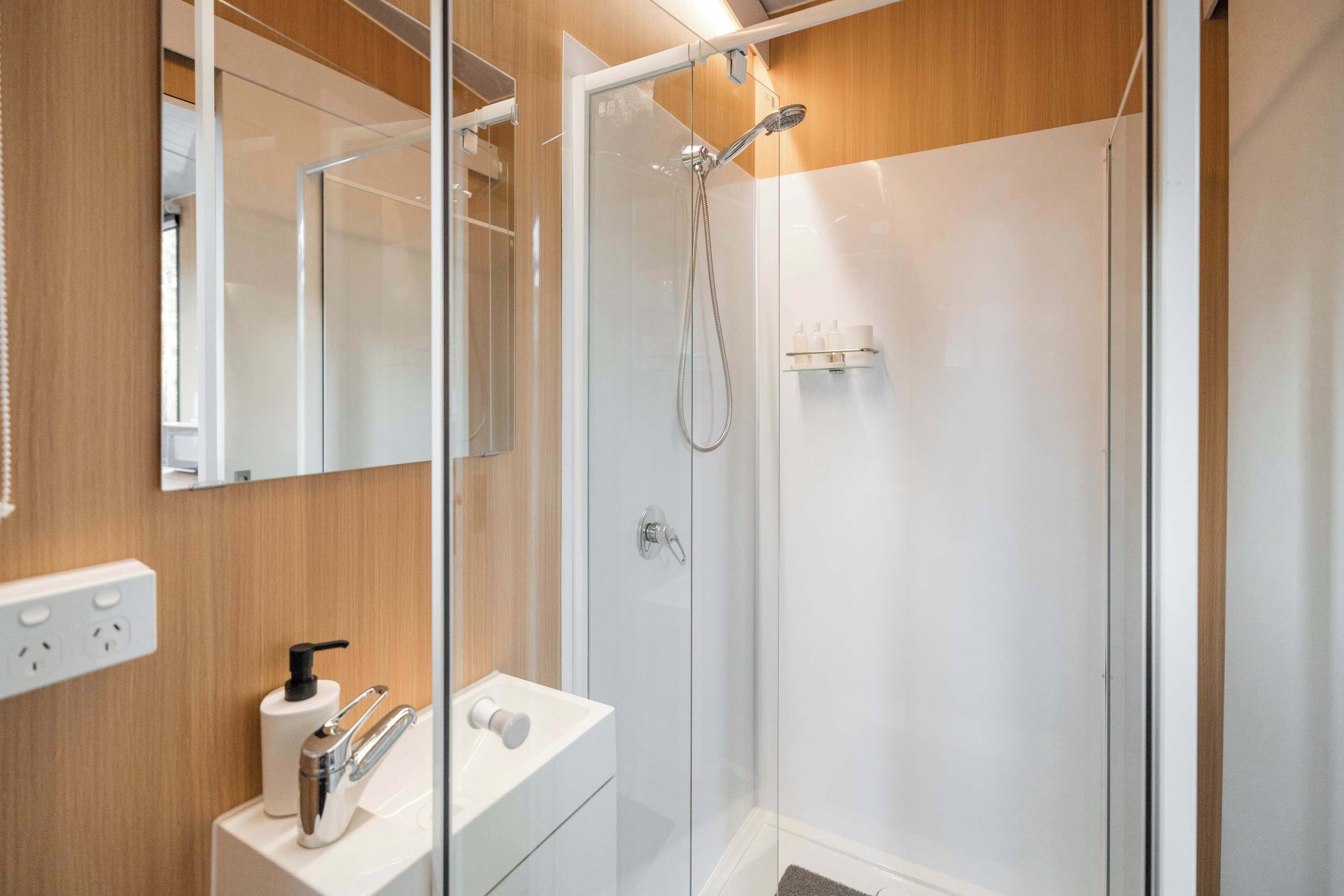 Shower, hair dryer, towels, shampoo