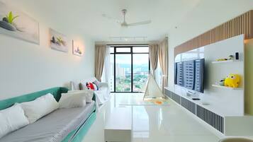 Deluxe Apartment, 2 Bedrooms, City View | Living area | 43-inch LED TV with digital channels