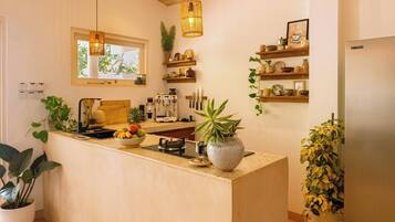 Fridge, stovetop, coffee/tea maker, electric kettle