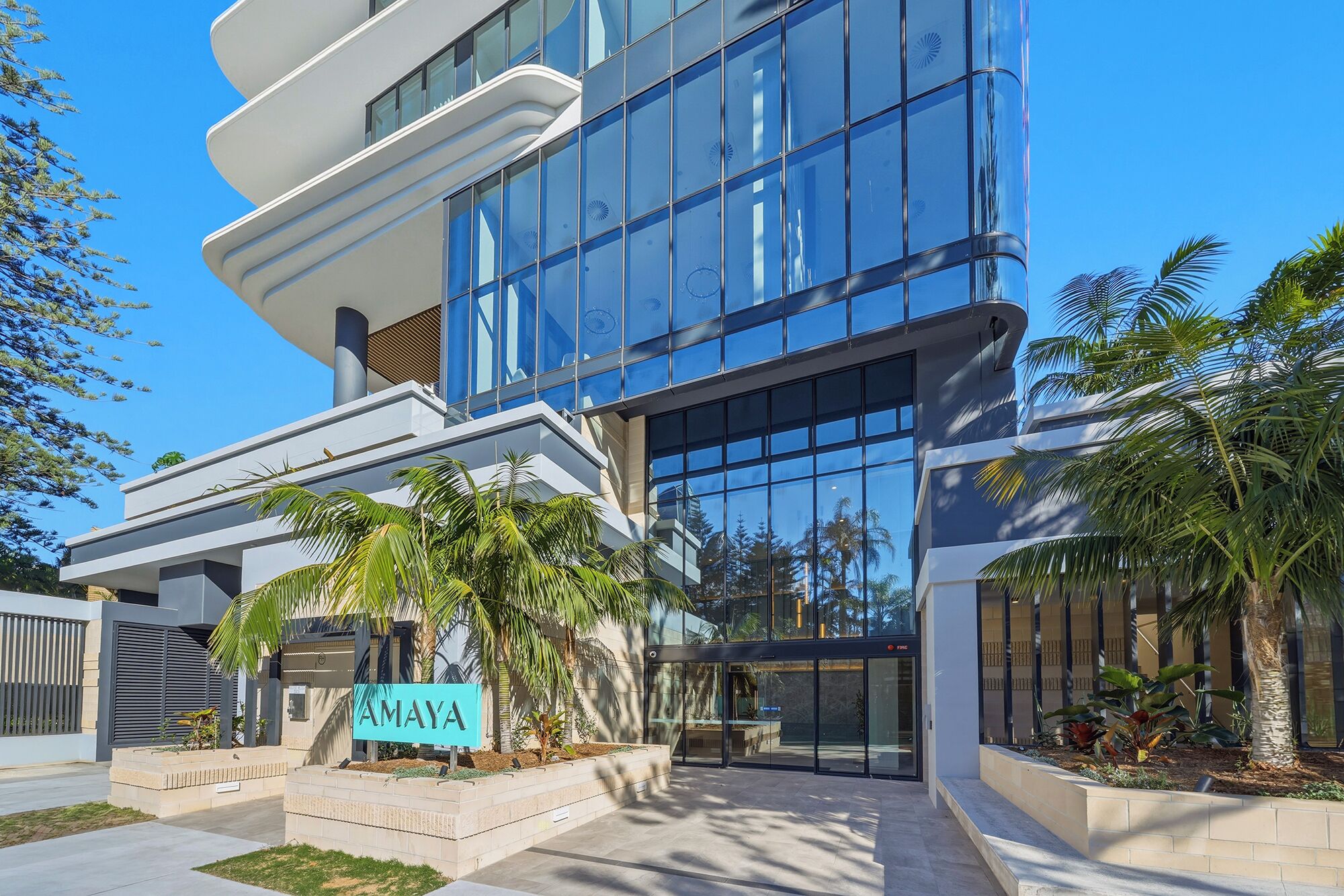 A modern building with a sign reading 'AMAYA' in front.