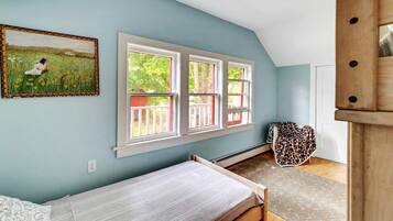 Desk, iron/ironing board, bed sheets
