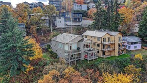 A multi-story residential building with a balcony and a garage.