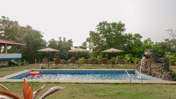 Outdoor pool, pool umbrellas, sun loungers