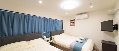 Quadruple Room | Desk, blackout drapes, iron/ironing board, free WiFi